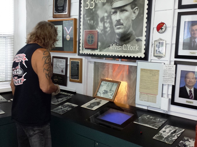 Jeff views the artifacts lining the sun room entrance.