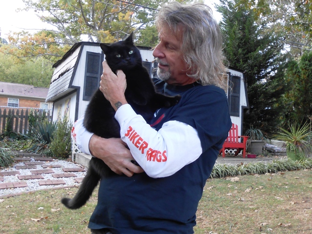 Jeff and Jumba in the back yard. Our fur kids are always glad to have us home.