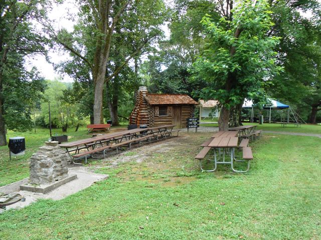 Long view of the replica cabin and surrounding area.