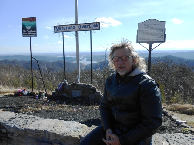Jeff sitting in front of the veteran markers.