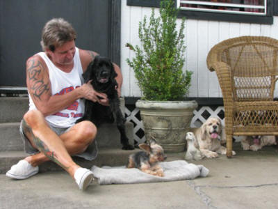 Jeff with all four of the dogs- Cindy, Shorty, Butter and Susie.