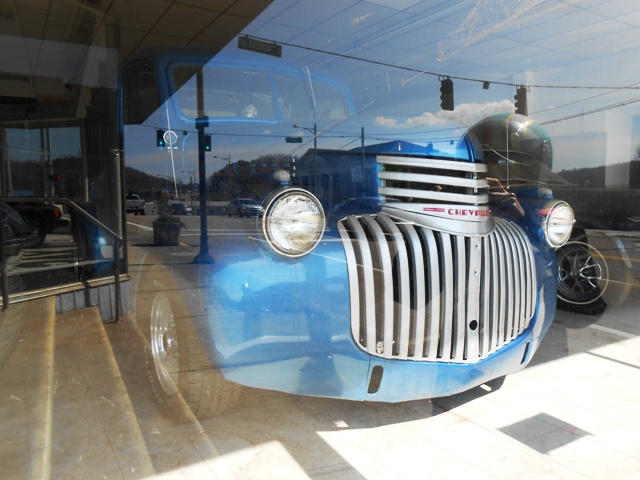 We looked at some antique cars in a downtown building.