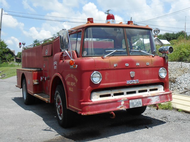 This nice vintage firetruck is parked across from the building with the MG's.