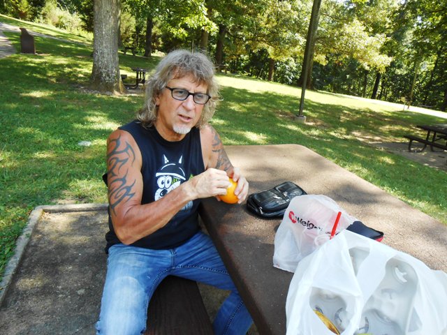 Jeff peels a delicious orange. Yum!